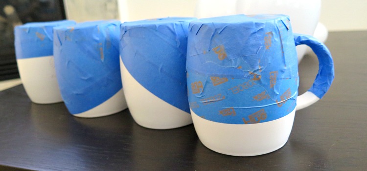 Spruce up old coffee mugs with this easy DIY! All you need is your favorite spray paint color and paint tape. Use as a gift or for everyday cup of coffee!
