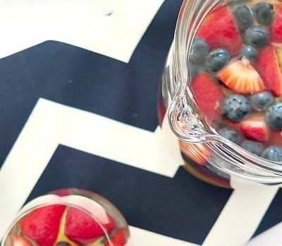 This easy to make summertime sangria is a perfect addition to your Memorial Day or 4th of July party with lots of fresh fruit!
