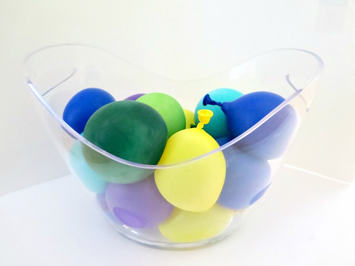 Fun twist to keep your drinks cool with these frozen water balloons! Easy way to add color to ANY occasion. Perfect for summer barbecues! 